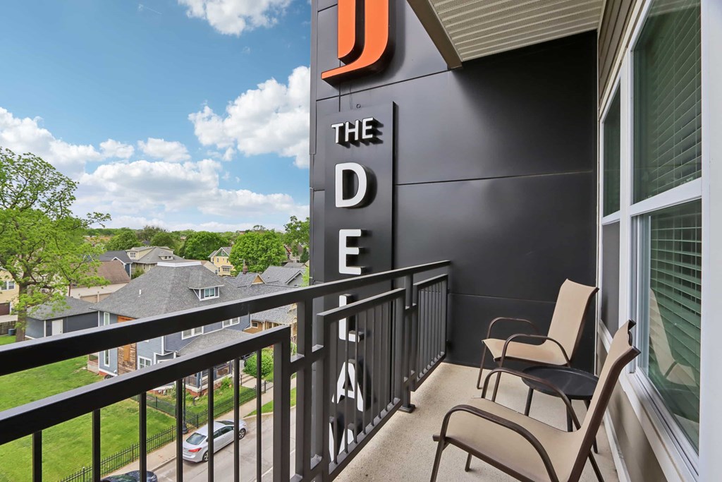 A balcony with a sign that says "The DDE".
