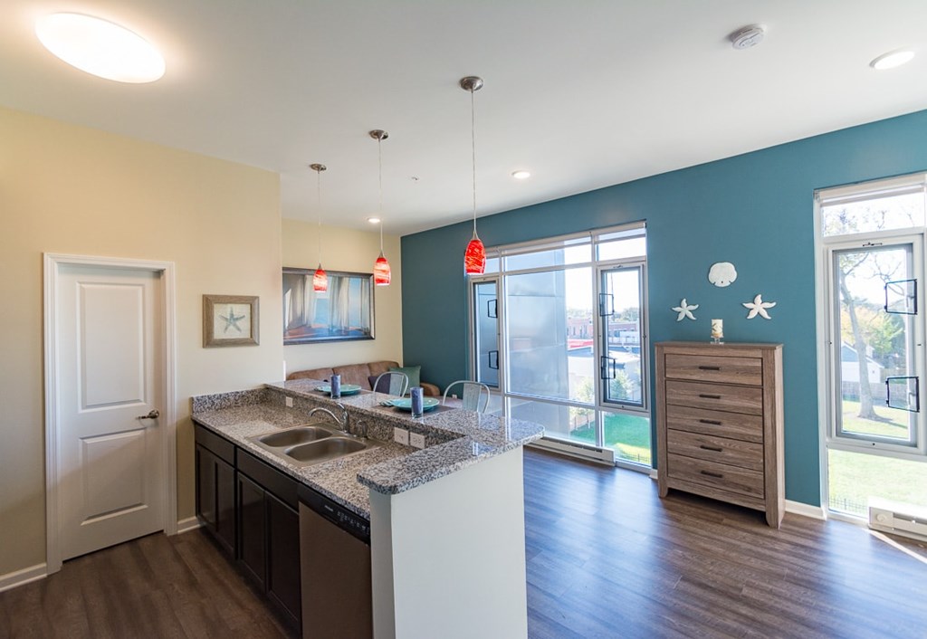 A kitchen with a sink and a counter.