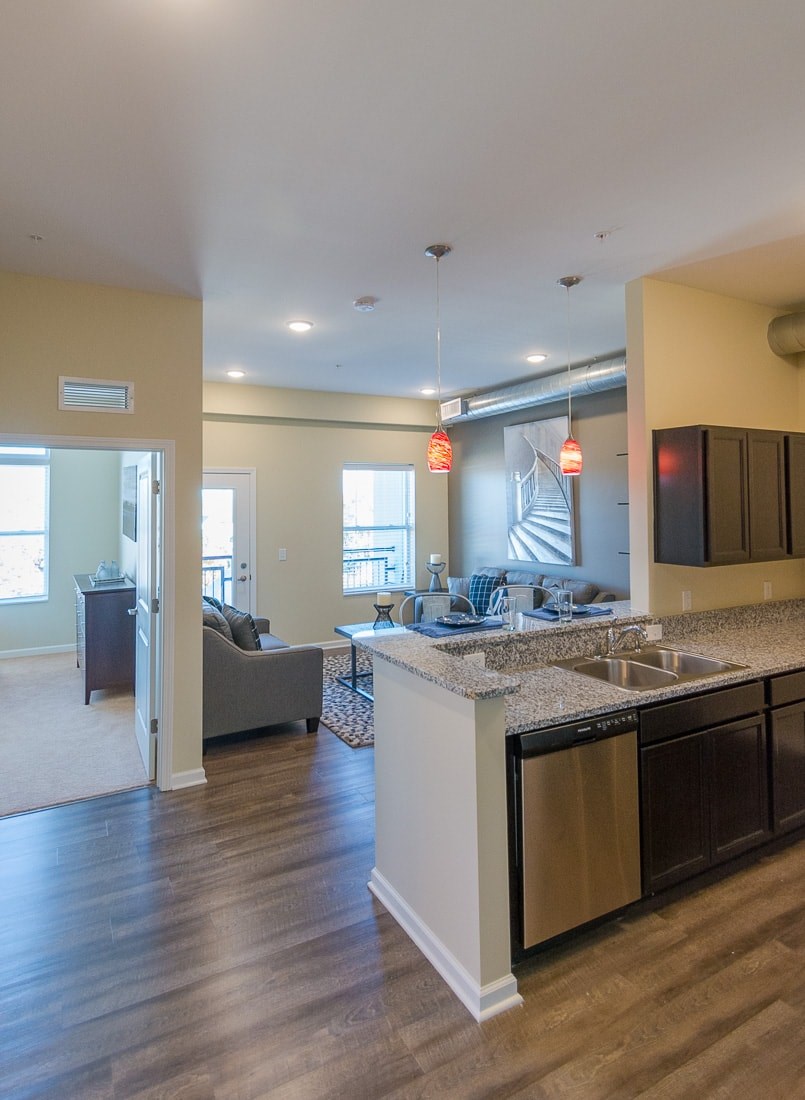 A kitchen with a sink and a counter.