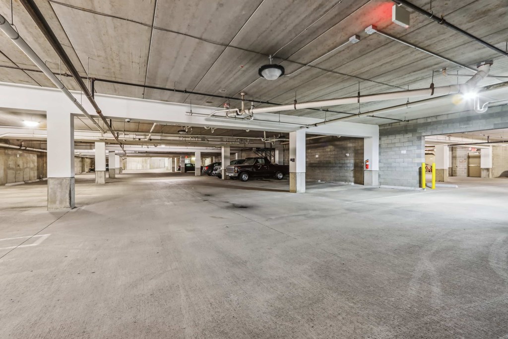 A large, empty parking garage with concrete floors and walls.