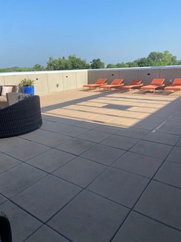 A patio with a table and chairs.