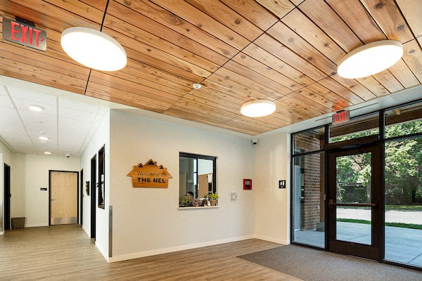 a lobby with a door and a sign for the inn