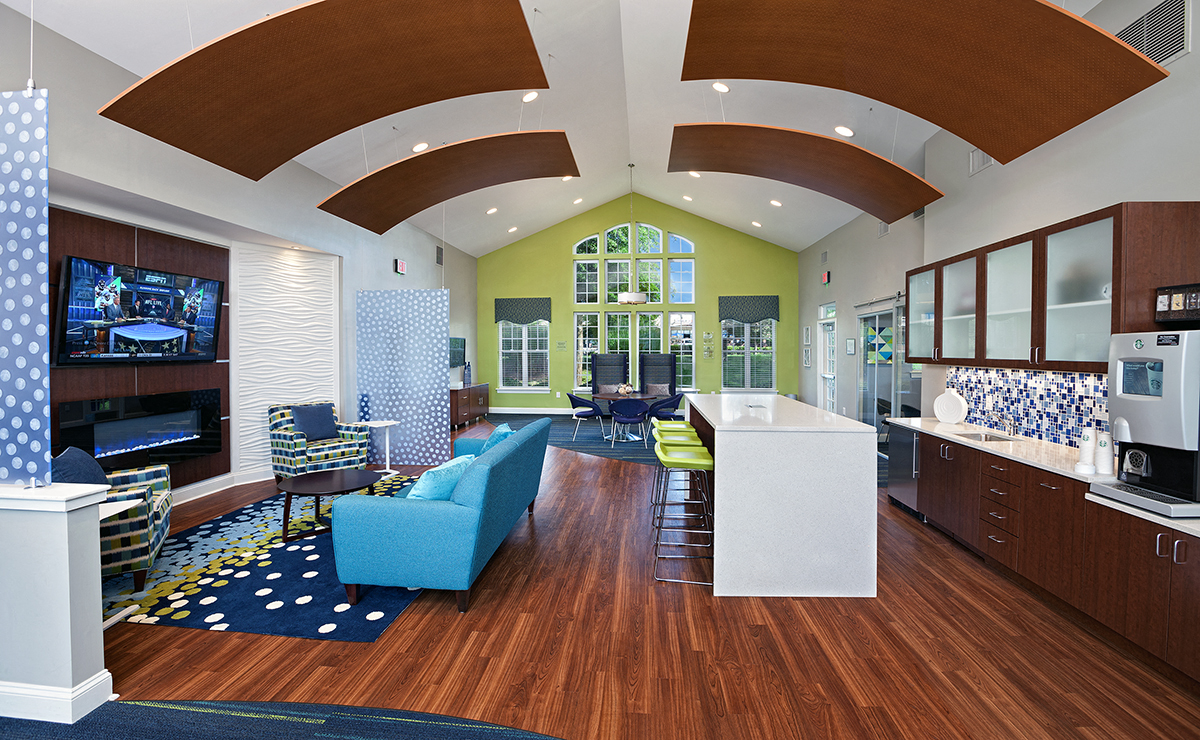 a rendering of a clubhouse with a kitchen and living room