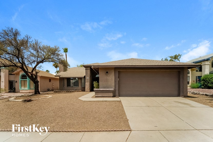 a house with a driveway and a garage door