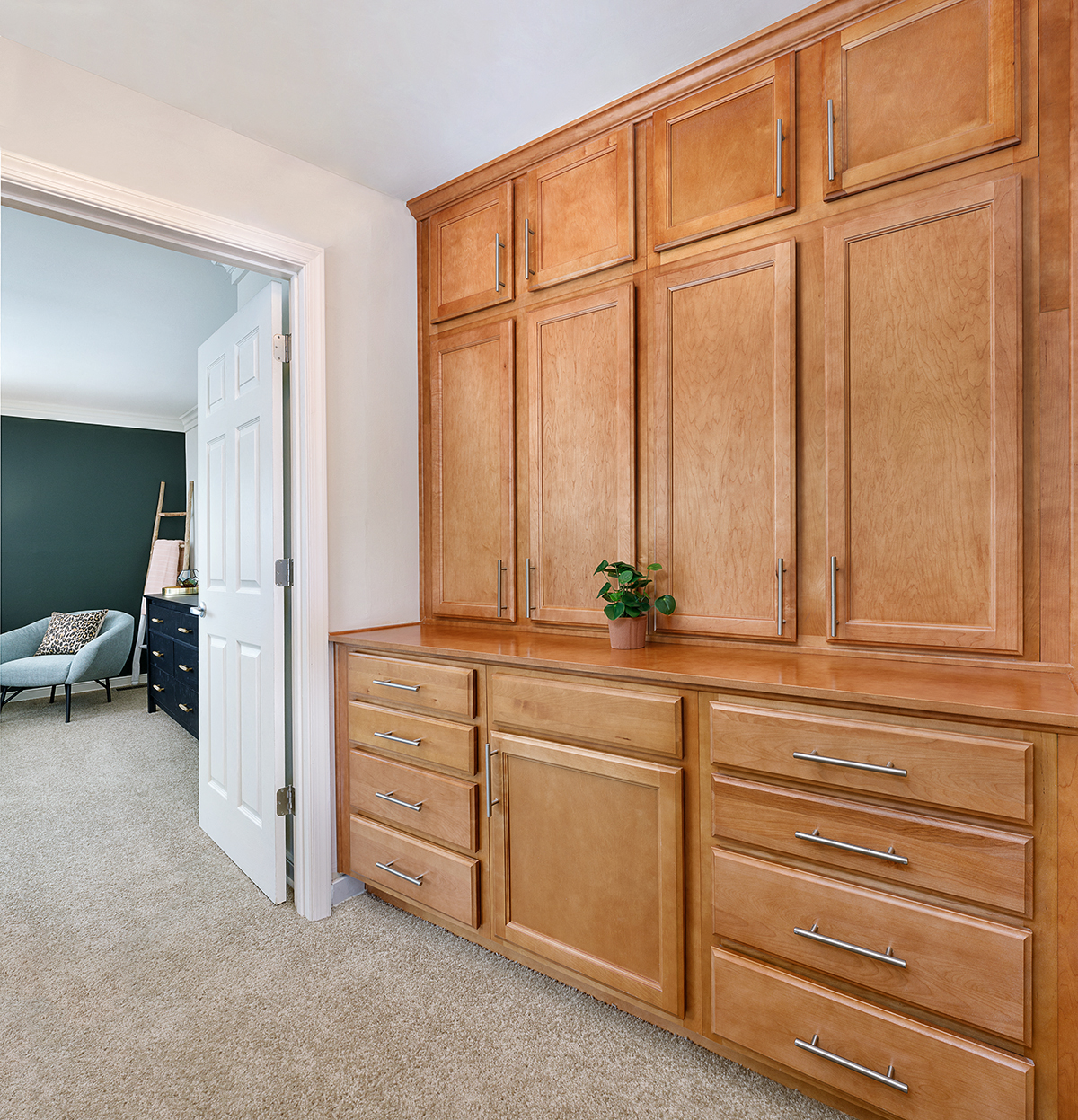 a large wooden dresser in a room with a door