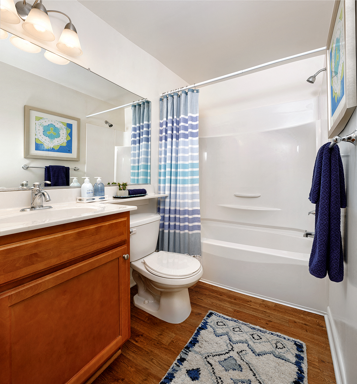 a bathroom with a toilet and a shower and a sink