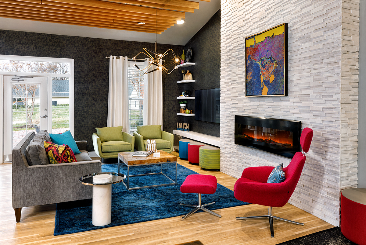 a living room filled with furniture and a fireplace