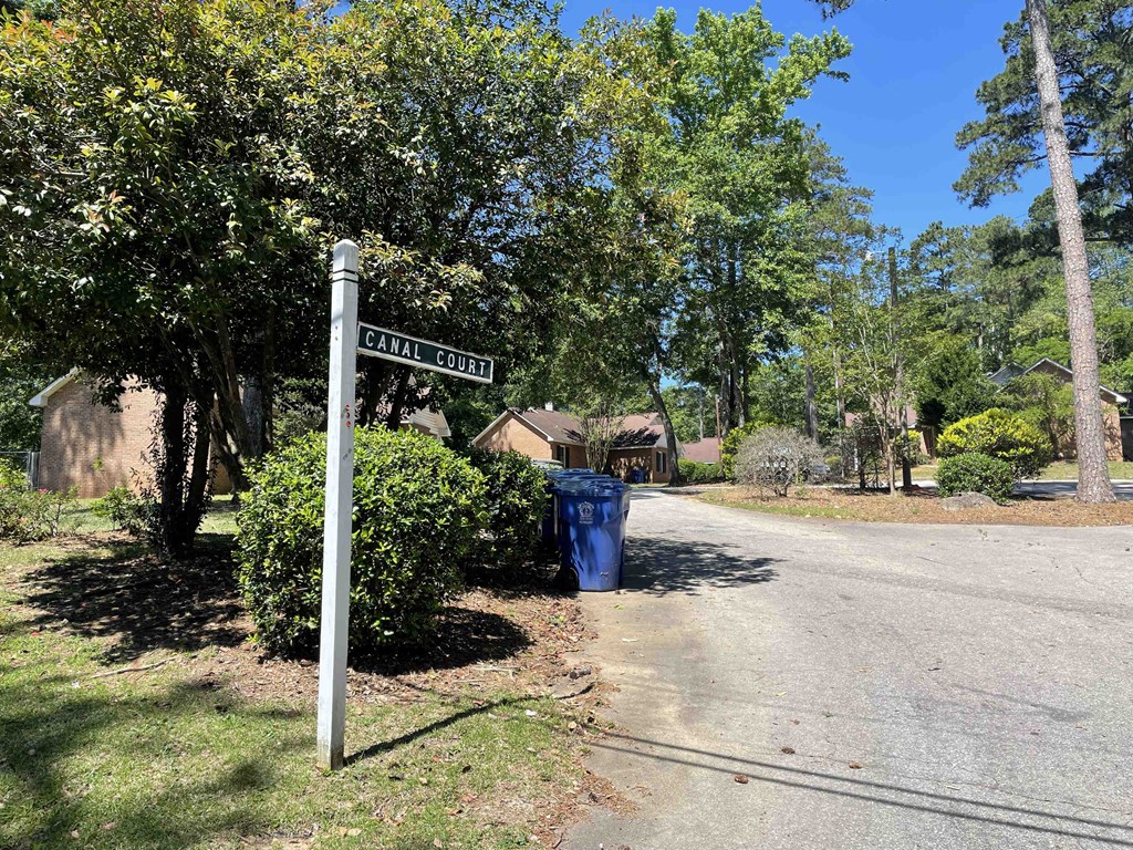 a street sign sitting on the side of a road