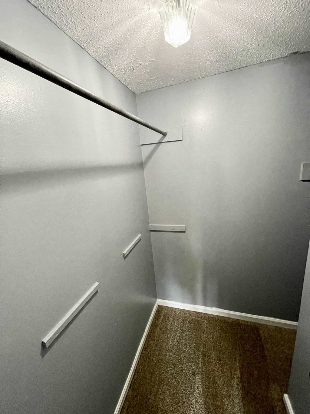 the walk in closet in the master bedroom of a house