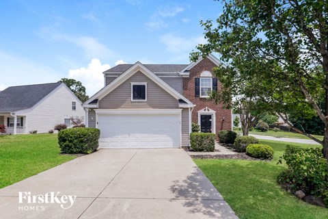 a house with a white garage door and a driveway