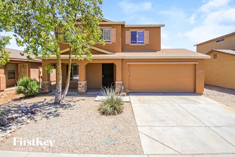 A house with a brown garage door is for sale.