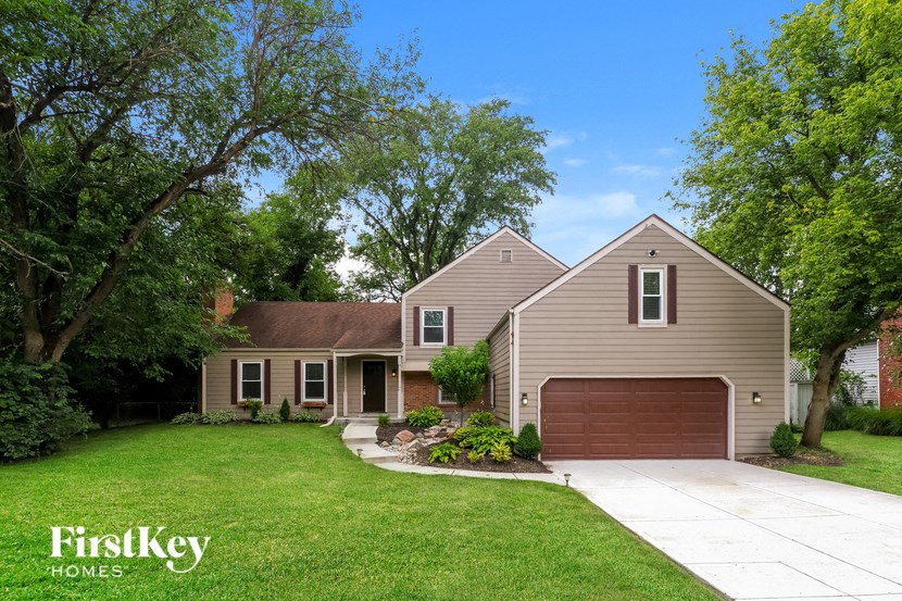 a house with a driveway and a garage door