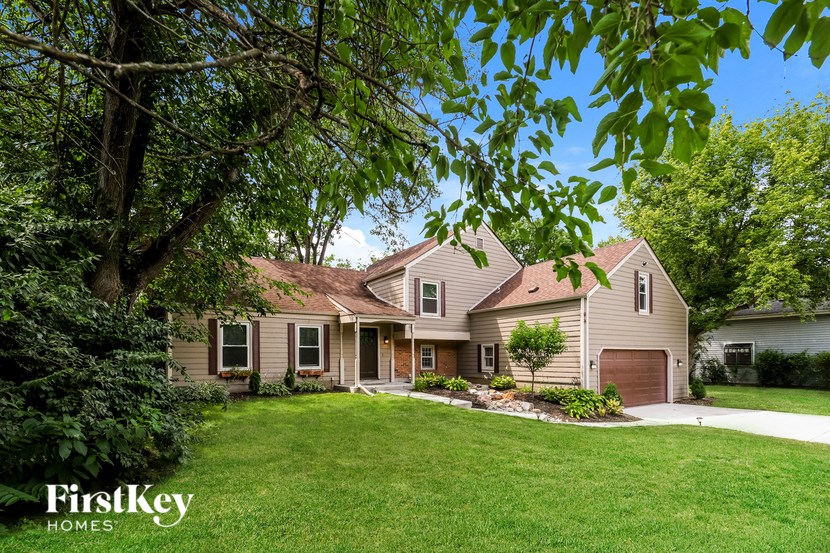a house with a yard and a driveway