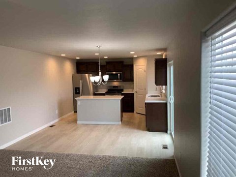 an open kitchen and living room in a house