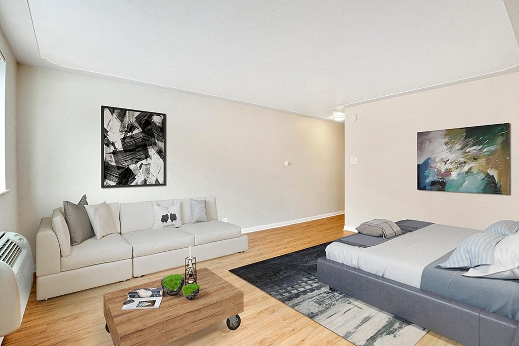 a living room with a couch and a bed