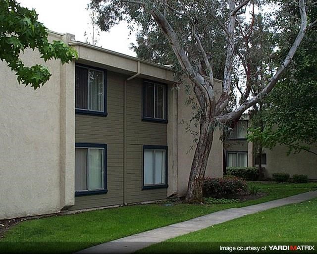 a building with a tree in front of it
