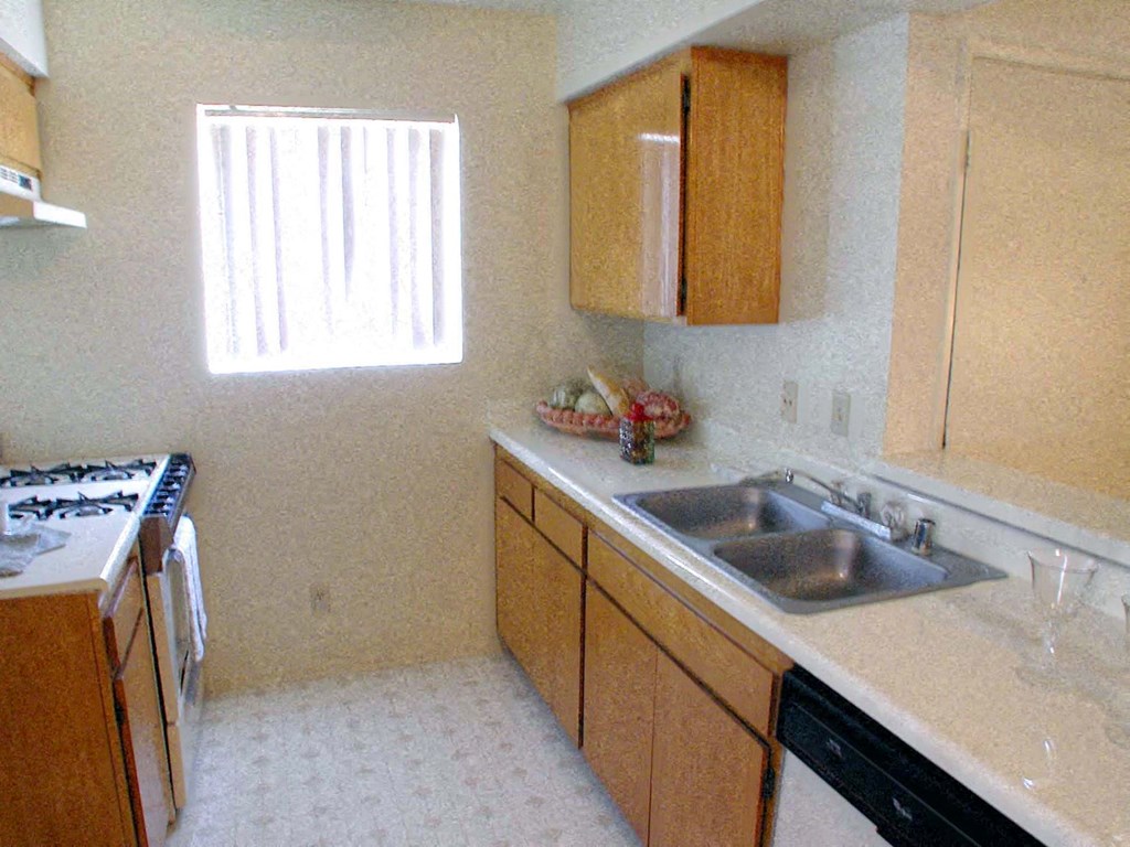 a kitchen with a sink and a stove