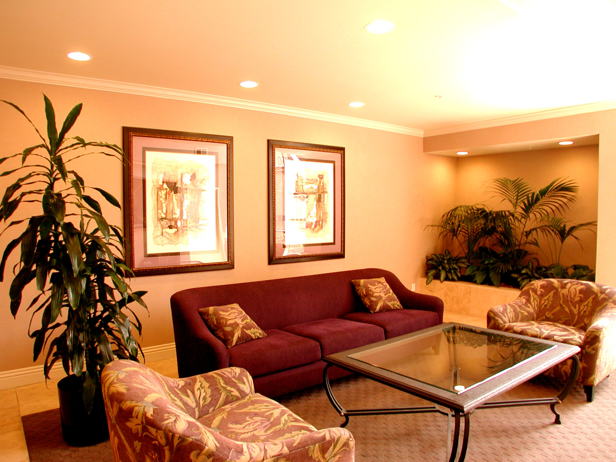 a living room with a couch and chairs and a table