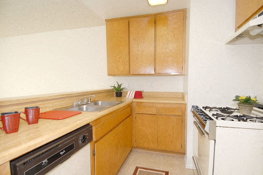 a small kitchen with a stove and a sink