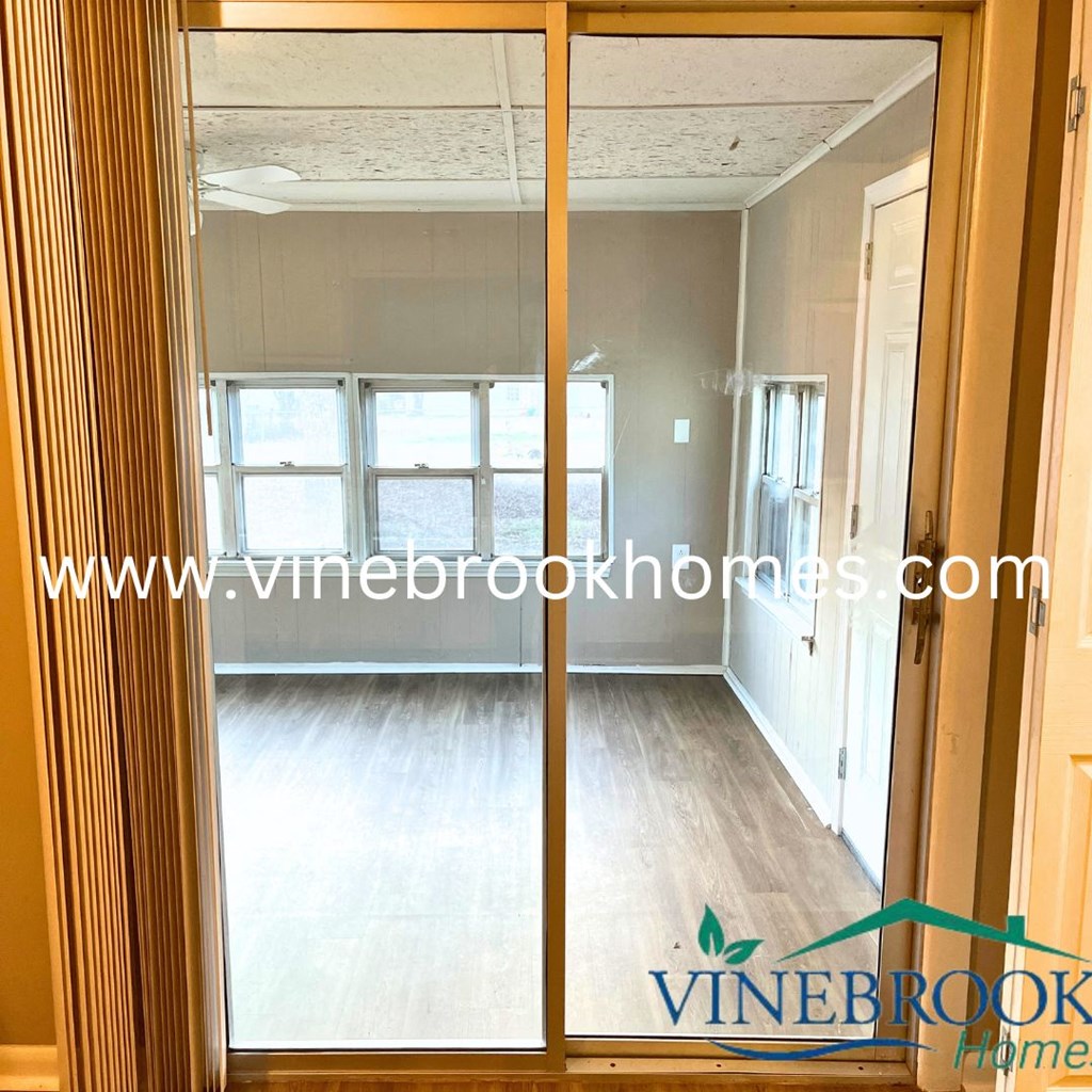 a window view of a living room from a glass door