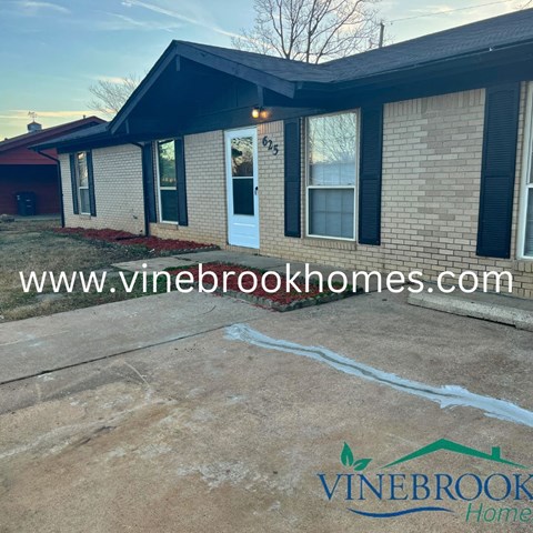 a house with a driveway in front of it