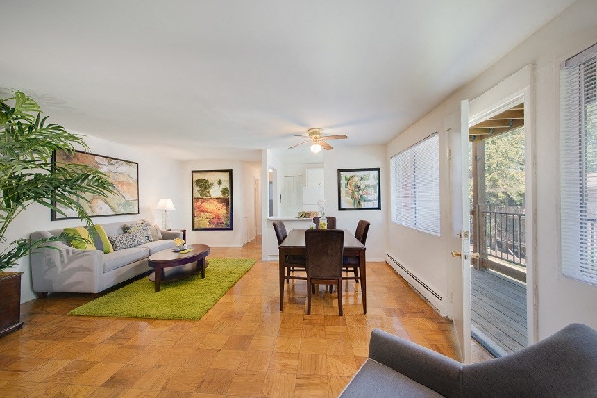 a living room with a couch and a dining room table