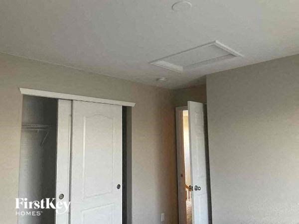 a room with a white ceiling and a white door