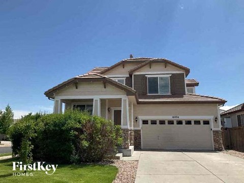 a house with a driveway and a garage door