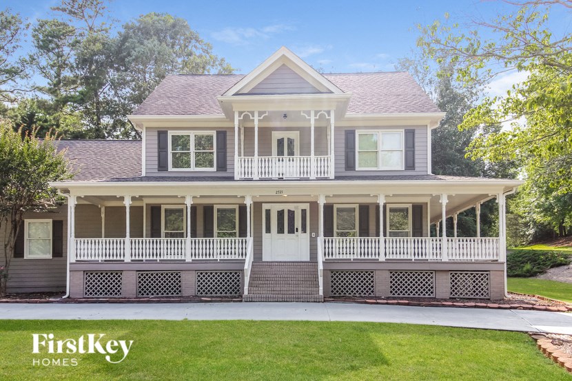 a house with a front porch and a porch swing
