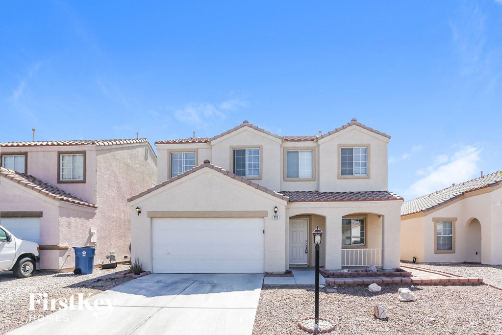 a house with a white garage door in front of it