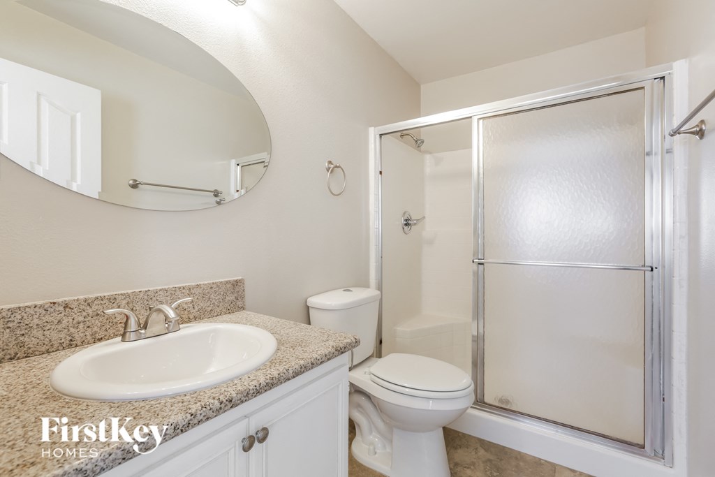 a bathroom with a sink toilet and a shower