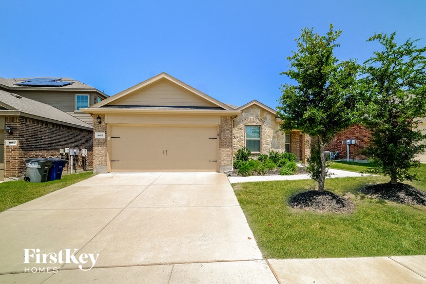 a house with a driveway and a garage door