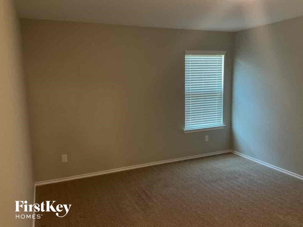 an empty room with a window in it