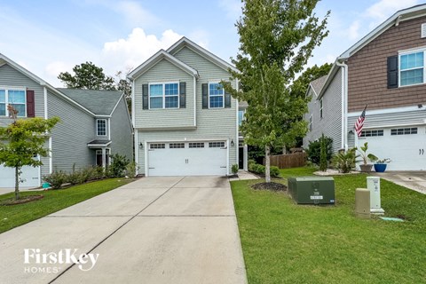 a house with a white garage door and a driveway