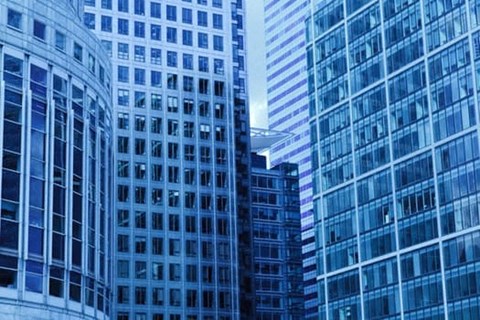 a group of tall skyscrapers in the middle of a city
