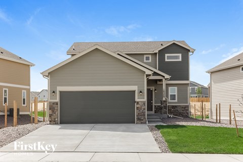 A house with a garage is for sale by FirstKey.