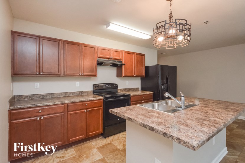 a kitchen with granite counter tops and a sink
