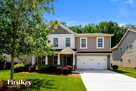 A large house with a garage is shown in the image.