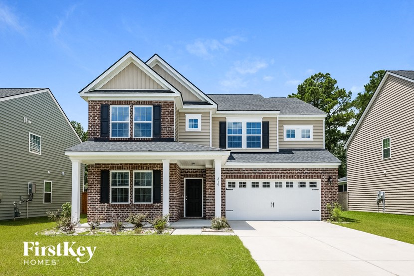 A house with a garage is for sale by FirstKey Homes.