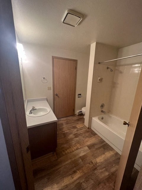 a small bathroom with a sink and a tub
