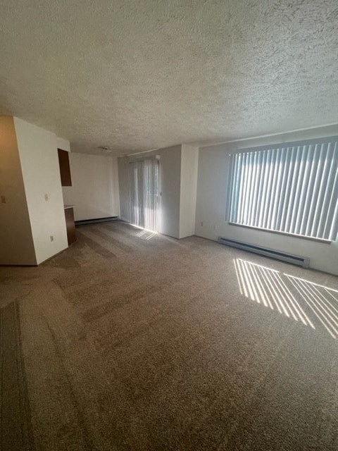 an empty living room with a large window