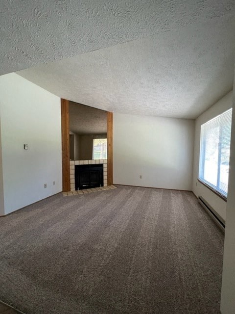 an empty living room with a fireplace