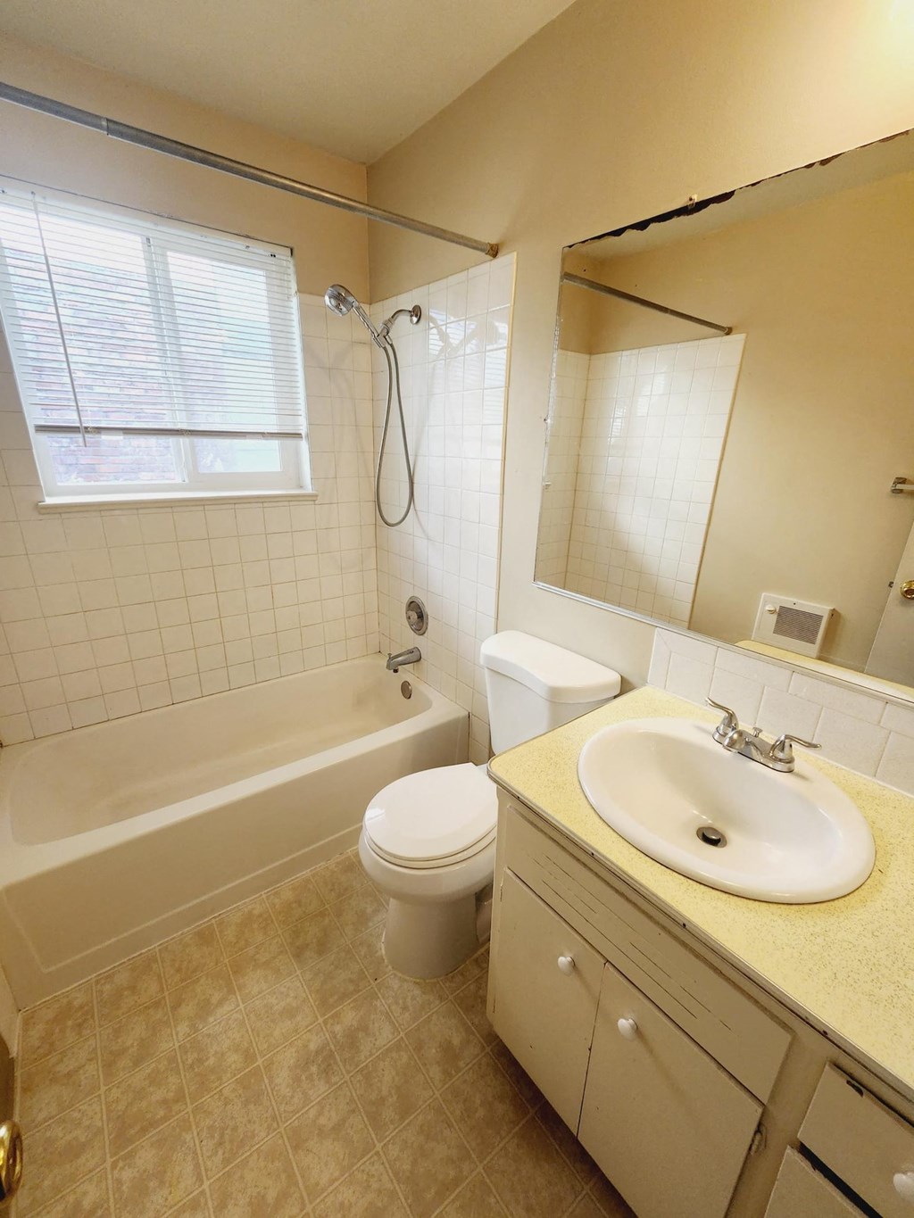 a bathroom with a sink toilet and a bath tub