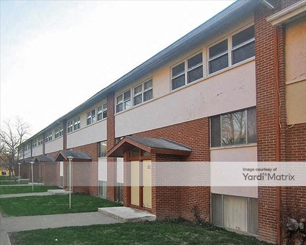 a building with a yard market sign in front of it