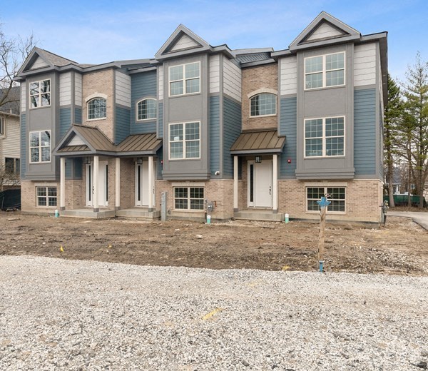an empty yard in front of a house