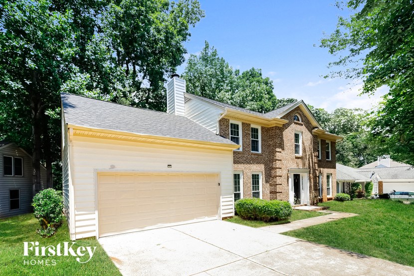A house with a garage is for sale by FirstKey Homes.