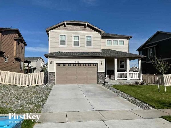 a house with a driveway and a garage door