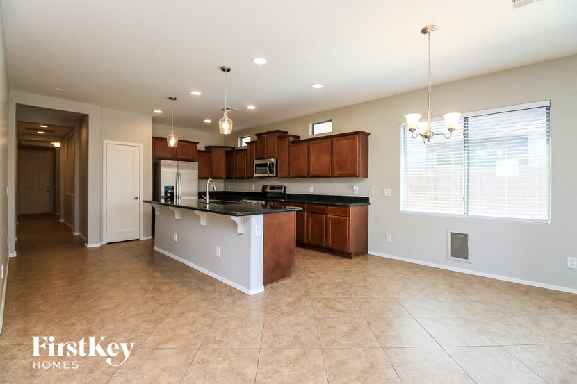 a large kitchen with an island in the middle