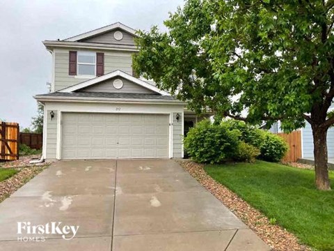 a house with a driveway and a garage door