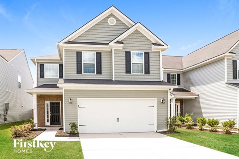 a house with a white garage door in front of it